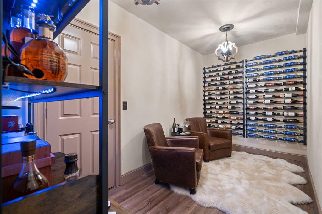 47 Brewster Road Sudbury, MA 01776 - Photo 32 of 41 a dining room with furniture and wooden floor