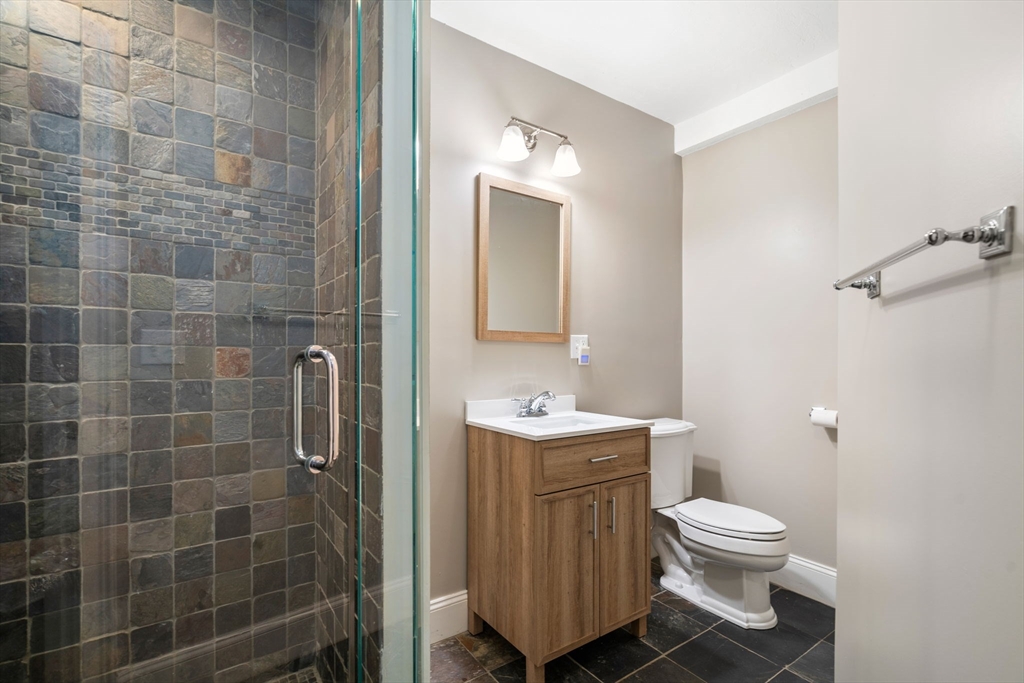 47 Brewster Road Sudbury, MA 01776 - Photo 33 of 41 a bathroom with a toilet sink and shower