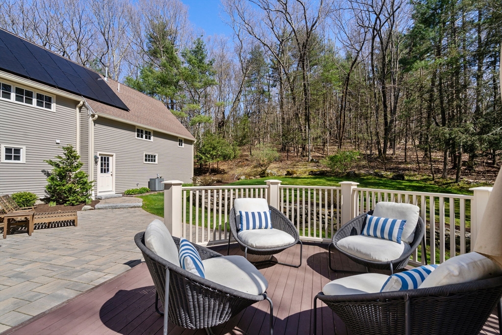 47 Brewster Road Sudbury, MA 01776 - Photo 38 of 41 a view of a chair and table in the balcony