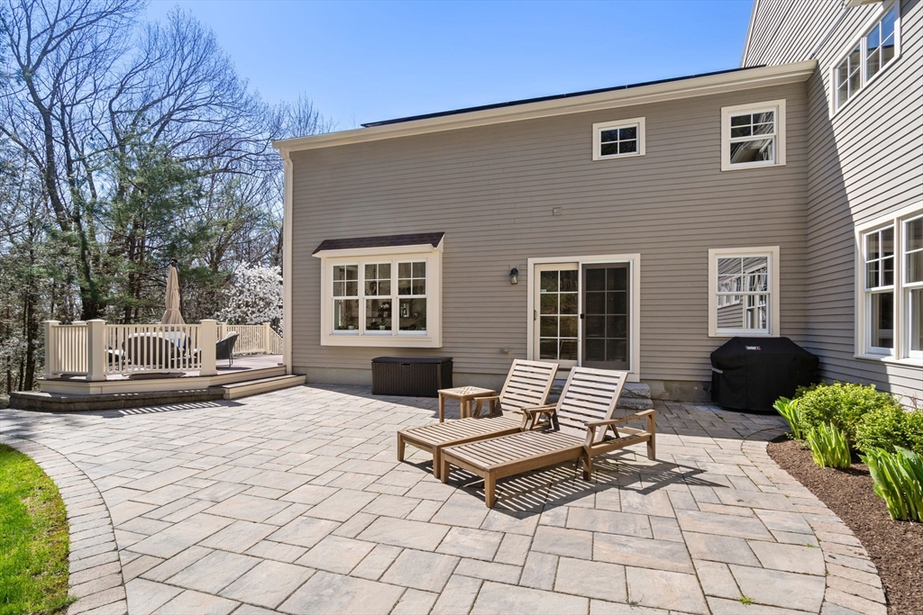 47 Brewster Road Sudbury, MA 01776 - Photo 39 of 41 a building outdoor space with a couch and chairs
