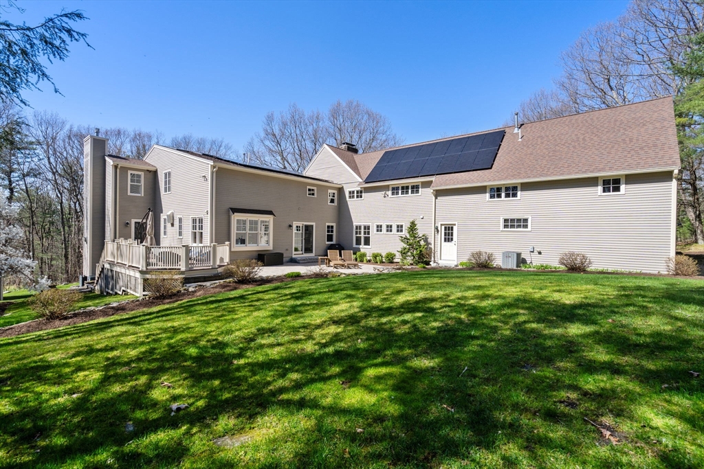 47 Brewster Road Sudbury, MA 01776 - Photo 40 of 41 a front view of a house with garden