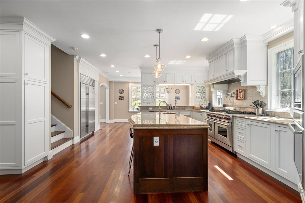 47 Brewster Road Sudbury, MA 01776 - Photo 5 of 41 a kitchen with stainless steel appliances granite countertop a stove and a refrigerator