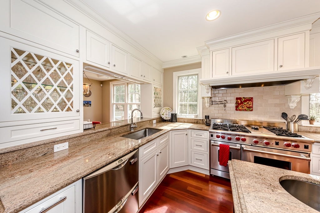 47 Brewster Road Sudbury, MA 01776 - Photo 6 of 41 a kitchen with a sink stove and cabinets