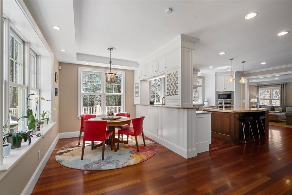47 Brewster Road Sudbury, MA 01776 - Photo 8 of 41 a dining room with furniture a large window and wooden floor