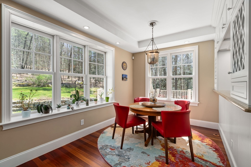 47 Brewster Road Sudbury, MA 01776 - Photo 9 of 41 a dining room with furniture a chandelier and wooden floor