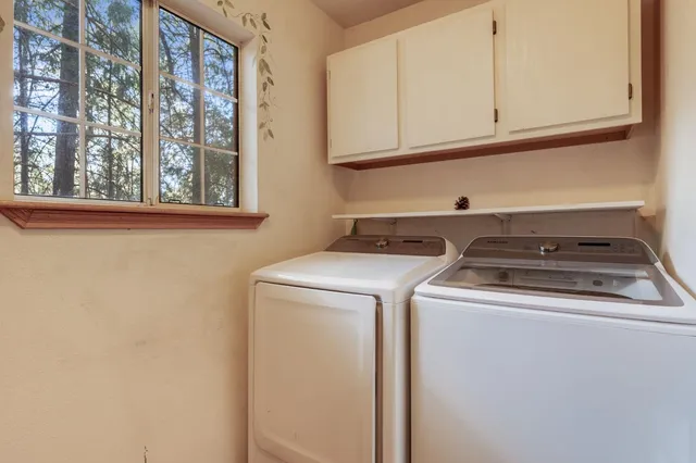 a bedroom with a large bed and a large window