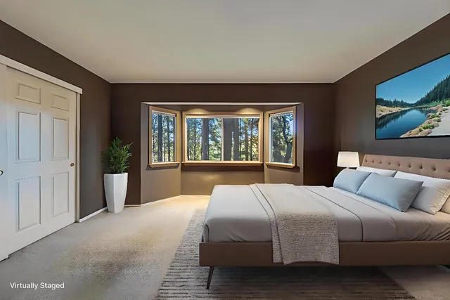 a bedroom with a bed and window