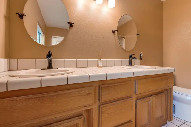 a bedroom with a bed and a desk in it