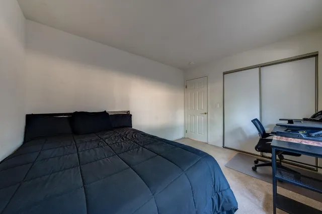 a bathroom with a sink a toilet and shower curtain