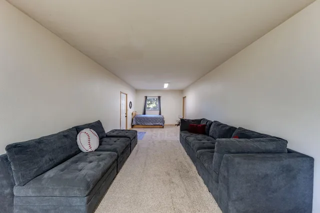 a balcony with wooden floor and fence