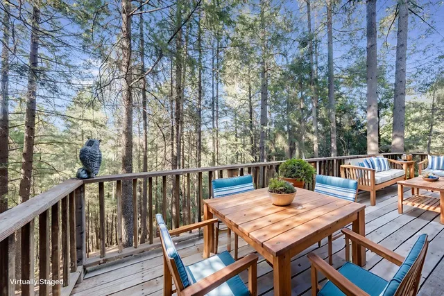 a balcony with wooden floor and fence
