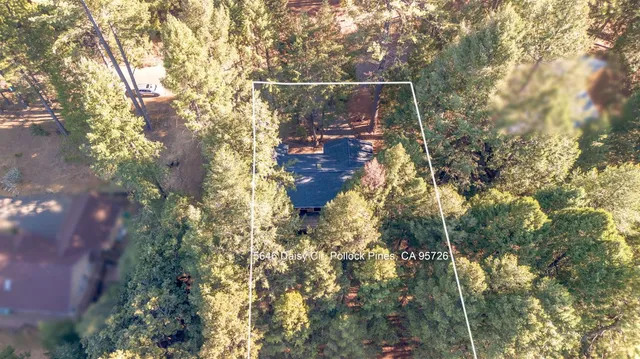 a kitchen with kitchen island a refrigerator a stove a microwave oven a sink with island and chairs with wooden floor