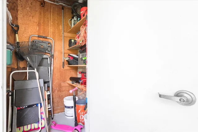 a front view of a house with a garden and plants