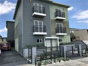 20520 1/2 South Western Avenue Torrance, CA 90501 - Photo 2 of 6 a front view of a house with a balcony