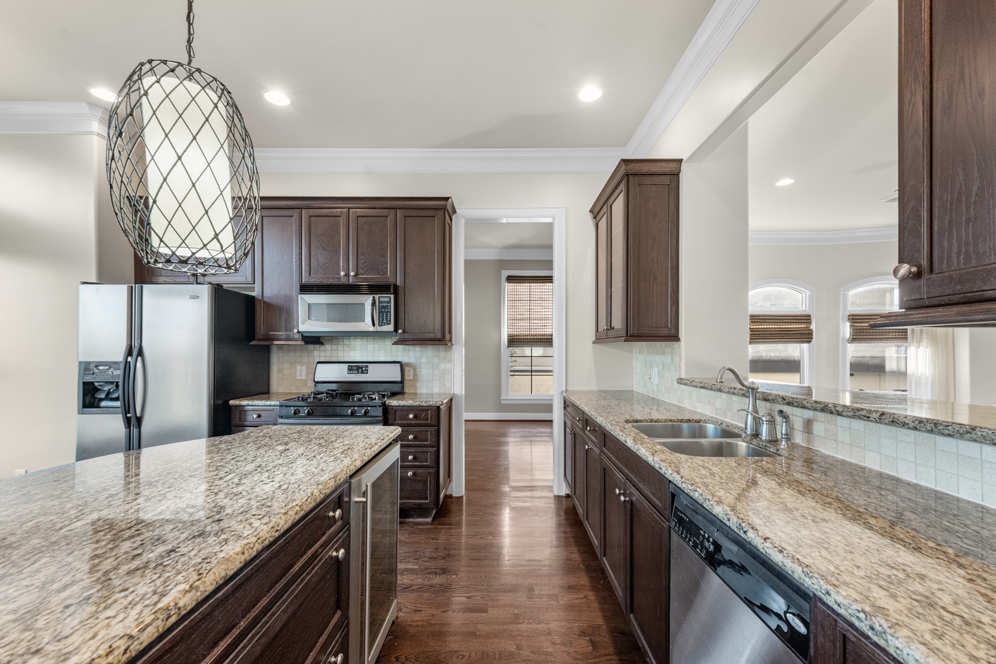 5106 Crawford Street Houston, TX 77004 - Photo 11 of 37 a kitchen with stainless steel appliances granite countertop a sink stove and refrigerator