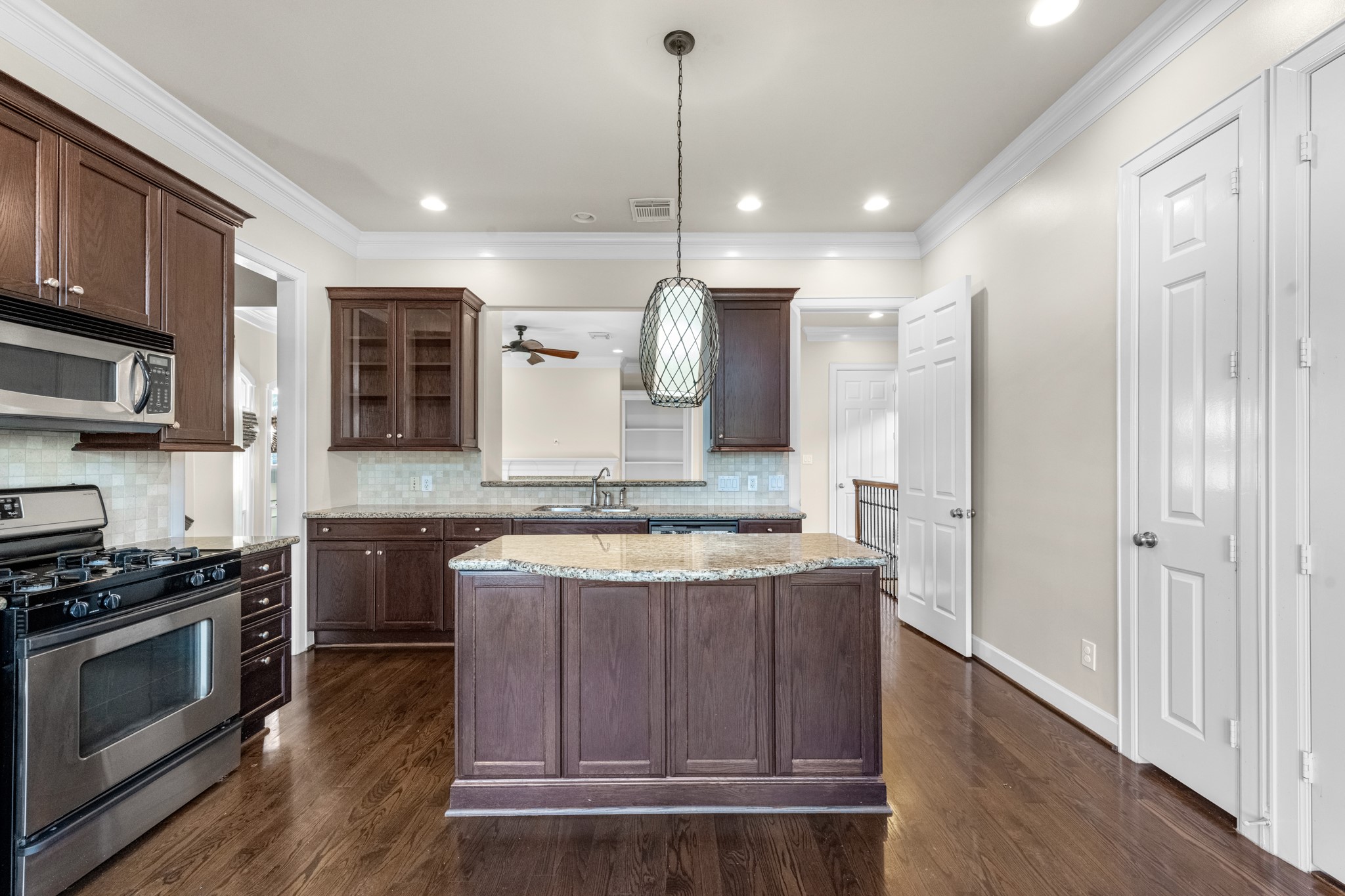 5106 Crawford Street Houston, TX 77004 - Photo 13 of 37 a kitchen with stainless steel appliances granite countertop a stove a sink and a refrigerator