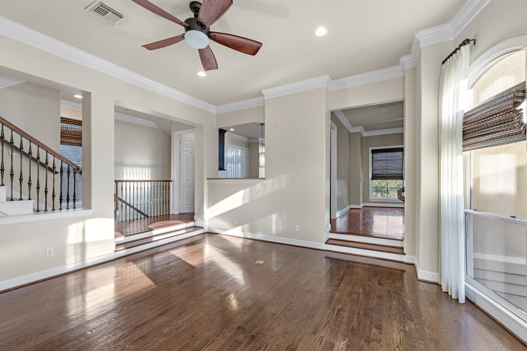 5106 Crawford Street Houston, TX 77004 - Photo 20 of 37 a view of empty room with wooden floor and fan