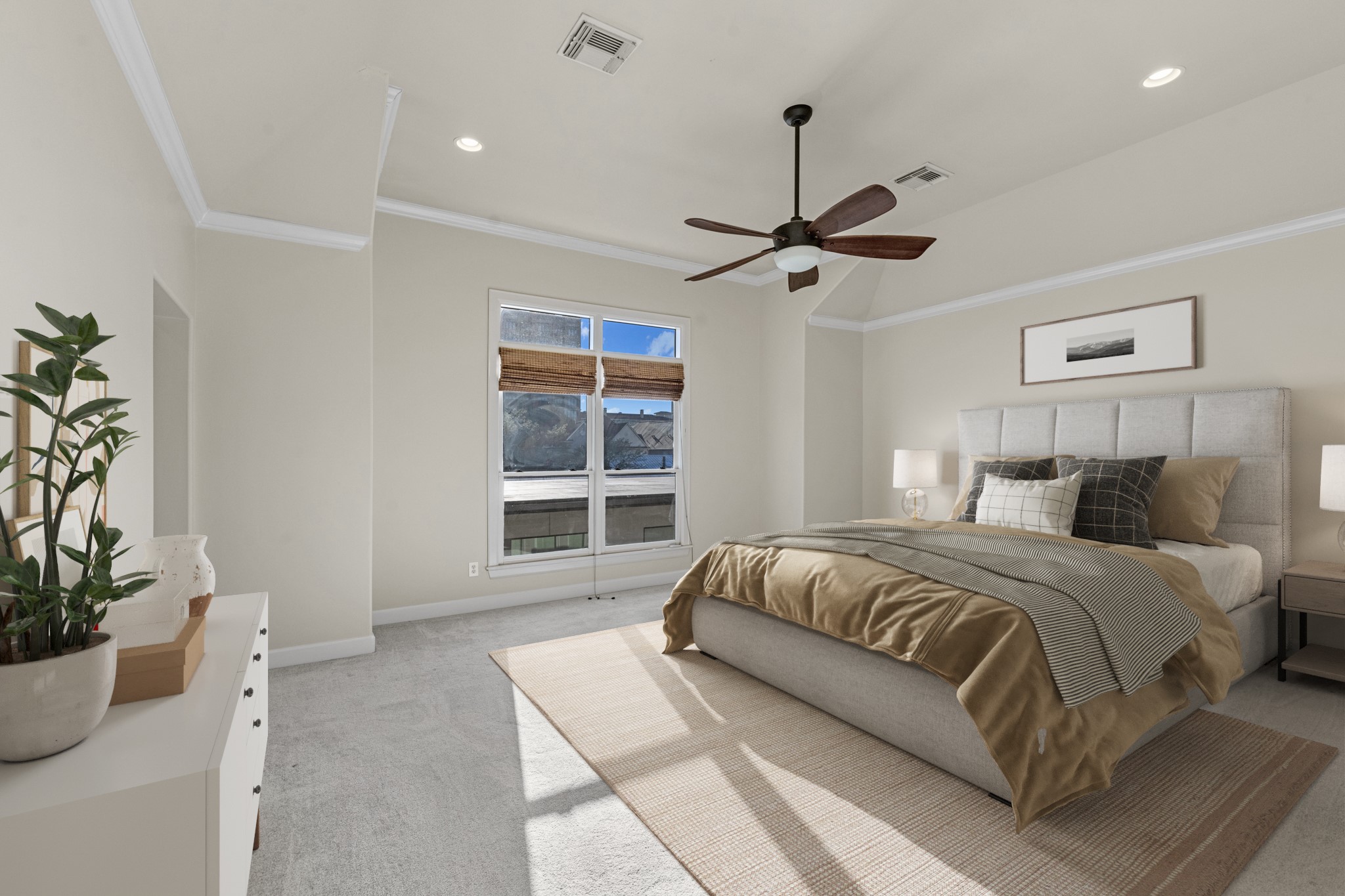 5106 Crawford Street Houston, TX 77004 - Photo 23 of 37 a spacious bedroom with a bed and a potted plant