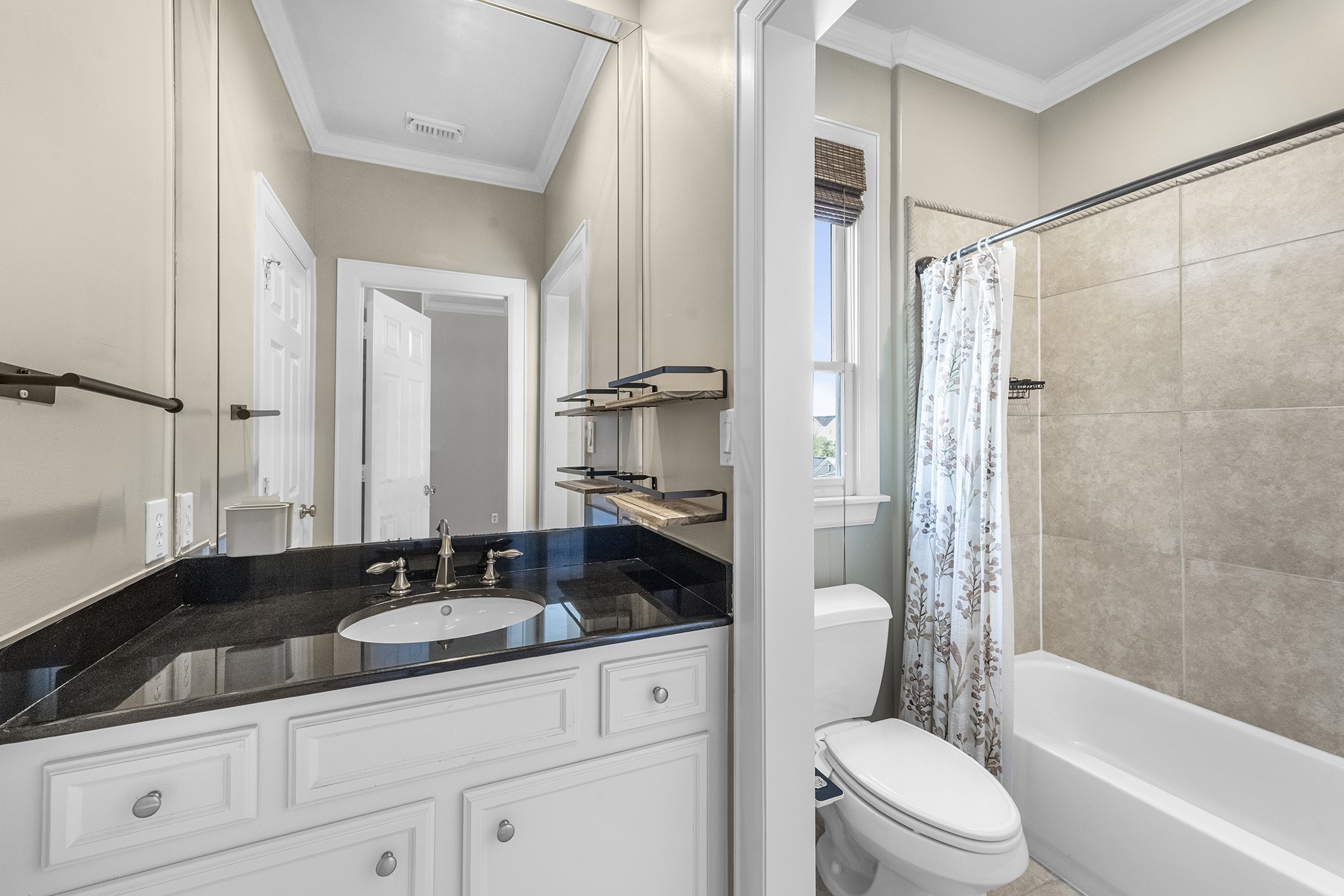 5106 Crawford Street Houston, TX 77004 - Photo 32 of 37 a bathroom with a granite countertop sink toilet and shower