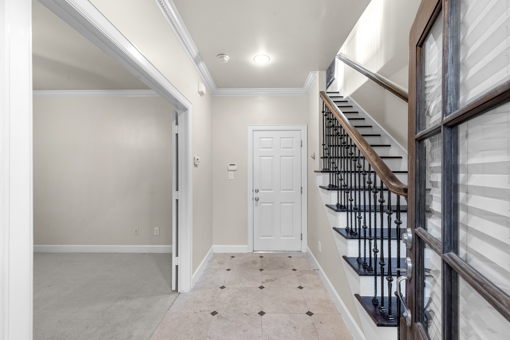 5106 Crawford Street Houston, TX 77004 - Photo 6 of 37 a view of a hallway with wooden floor and entryway