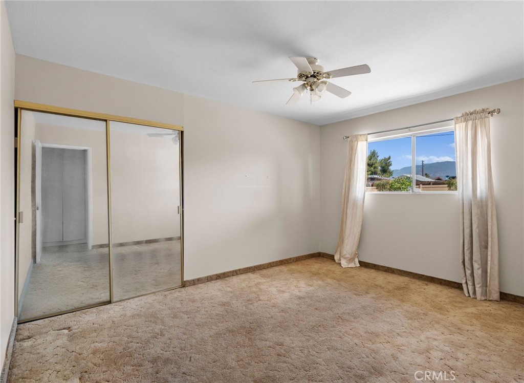 26652 7th Street Highland, CA 92346 - Photo 14 of 27 a view of an empty room with a fan