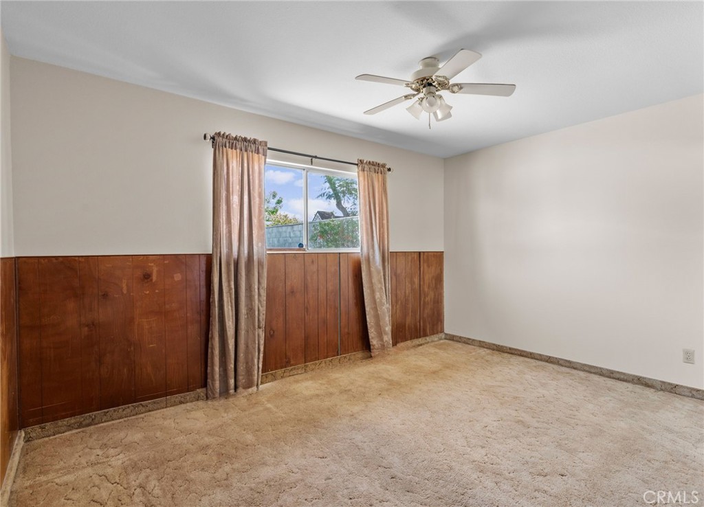 26652 7th Street Highland, CA 92346 - Photo 19 of 27 an empty room with windows and fan