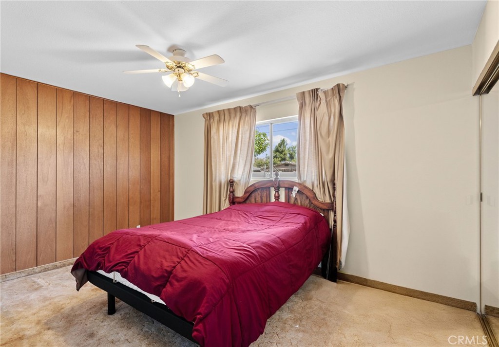 26652 7th Street Highland, CA 92346 - Photo 21 of 27 a bed sitting in a spacious bedroom next to a window