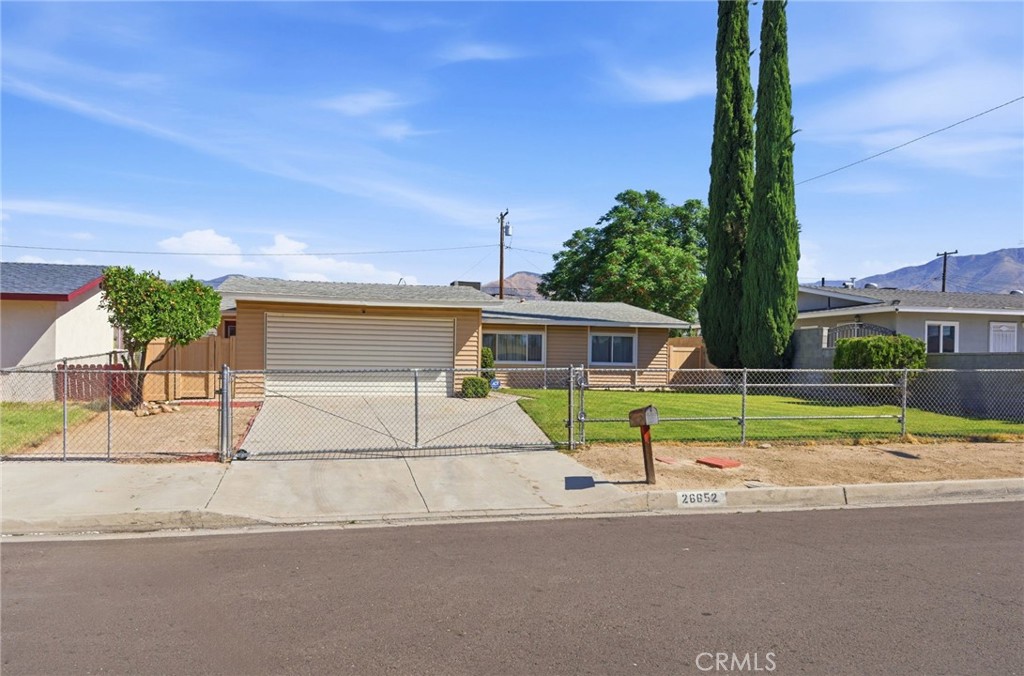 26652 7th Street Highland, CA 92346 - Photo 4 of 27 front view of house with a yard