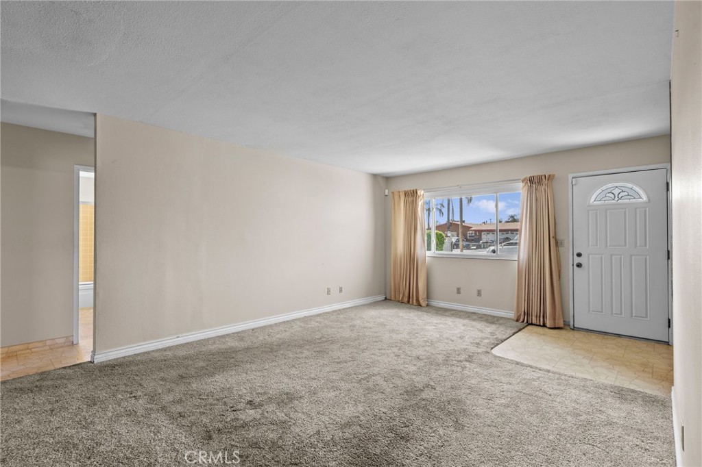 26652 7th Street Highland, CA 92346 - Photo 7 of 27 a view of a livingroom with a kitchen