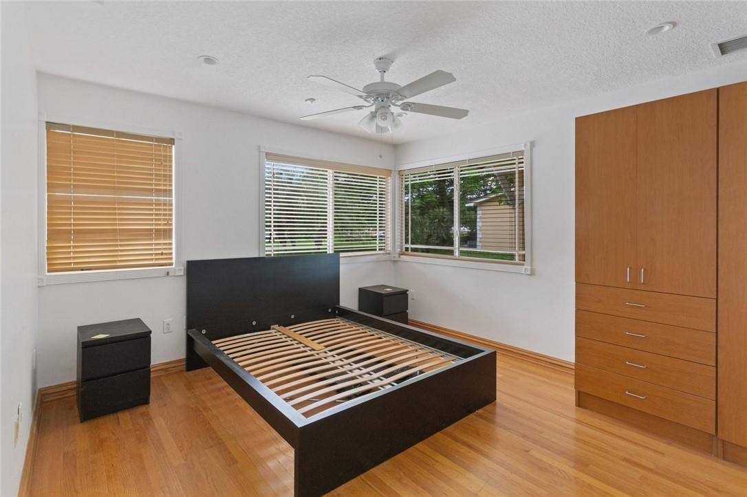 6311 Melaleuca Road Southwest Ranches, FL 33330 - Photo 21 of 33 a bedroom with a bed and a window