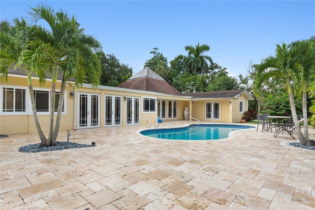 6311 Melaleuca Road Southwest Ranches, FL 33330 - Photo 28 of 33 a front view of a house with garden