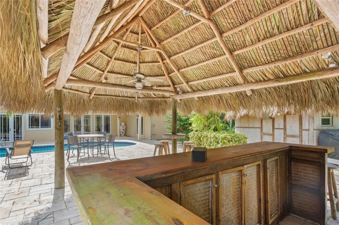 6311 Melaleuca Road Southwest Ranches, FL 33330 - Photo 29 of 33 a view of a patio with a table and chairs and potted plants