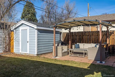 a view of a backyard with sitting area