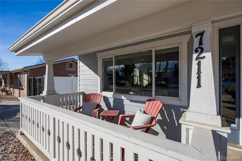 a view of a house with a wooden deck