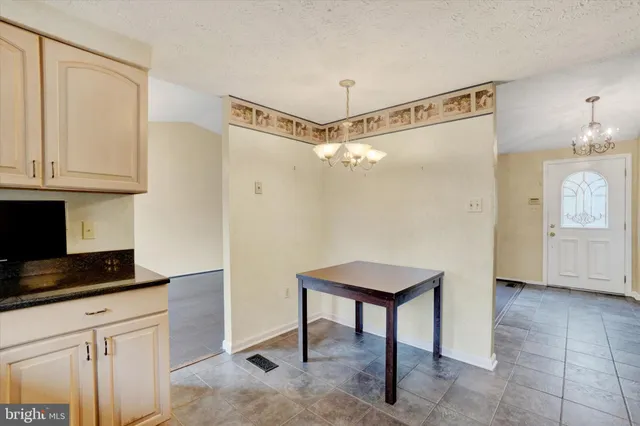 a spacious bathroom with a shower and a sink