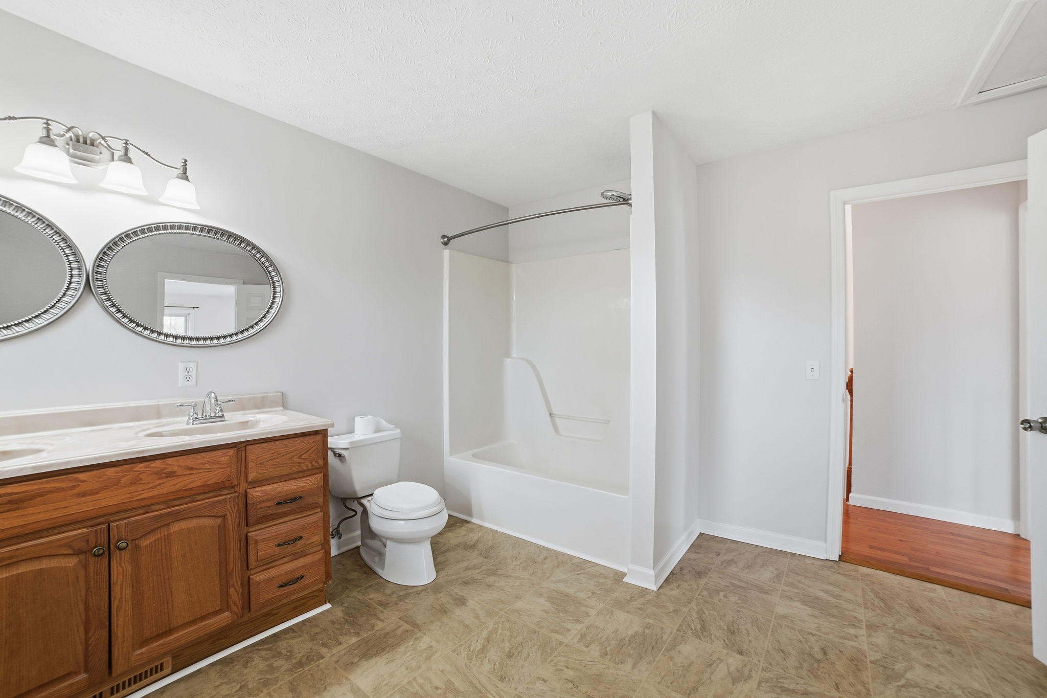 1130 Windsor Circle Lyles, TN 37098 - Photo 12 of 26 a bathroom with a granite countertop toilet sink and mirror