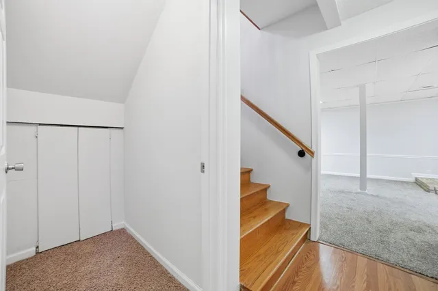 a view of a hallway view with staircase