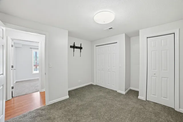 an empty room with closet area