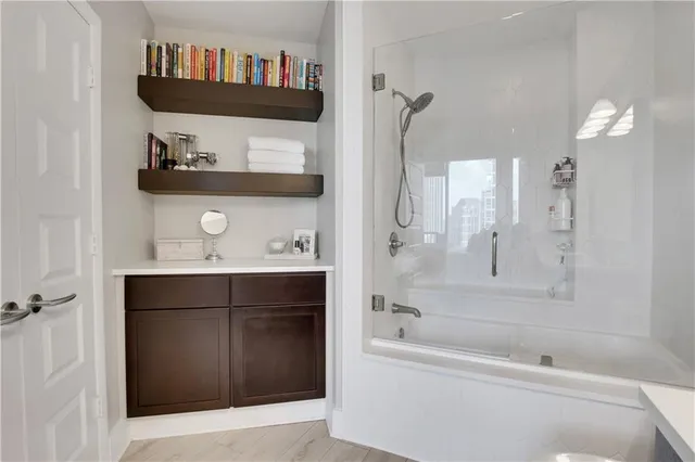 a bathroom with a bathtub and a shower