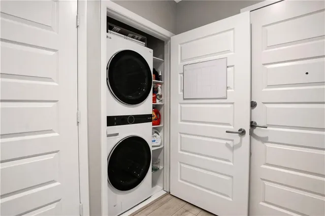 a close view of a utility room with dryer and washer