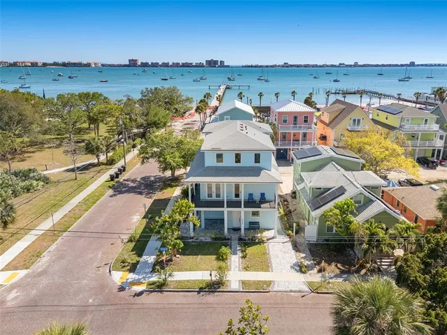 an aerial view of a house with a ocean view