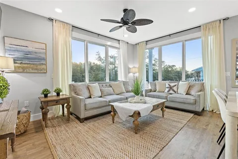 a kitchen with stainless steel appliances granite countertop a sink a counter space and a dining table