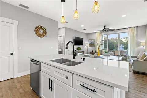 a bathroom with a toilet sink vanity and mirror