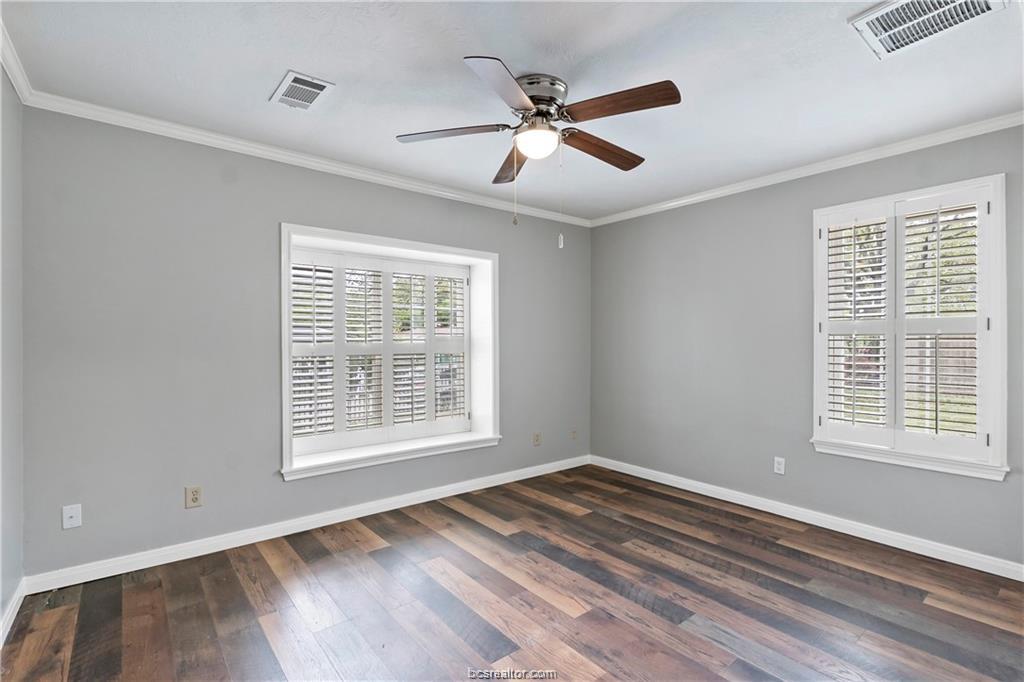 1409 Fannin Street, Unit A Bryan, TX 77803 - Photo 18 of 21 a view of an empty room with wooden floor and a window