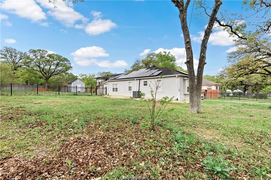 1409 Fannin Street, Unit A Bryan, TX 77803 - Photo 21 of 21 a view of a house with backyard and a tree