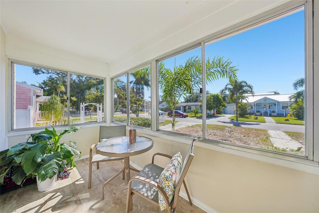 4809 33rd Avenue North St. Petersburg, FL 33713 - Photo 11 of 62 a dining room with furniture and a floor to ceiling window
