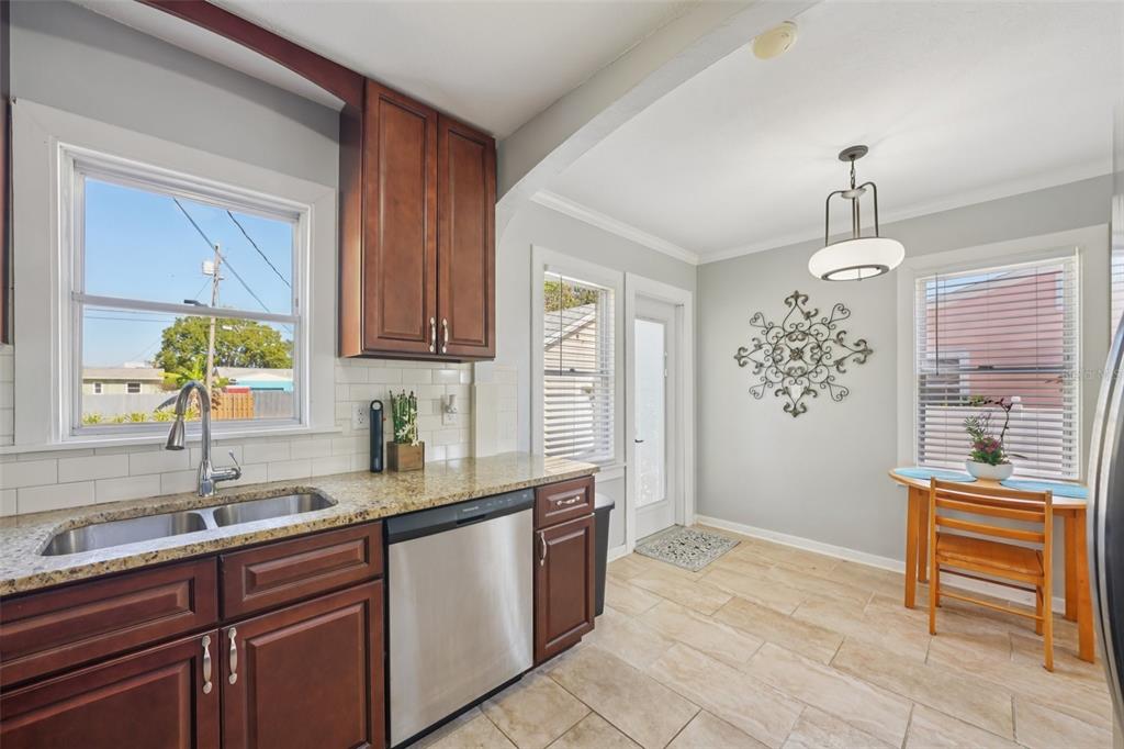 4809 33rd Avenue North St. Petersburg, FL 33713 - Photo 19 of 62 a kitchen with a refrigerator and a sink