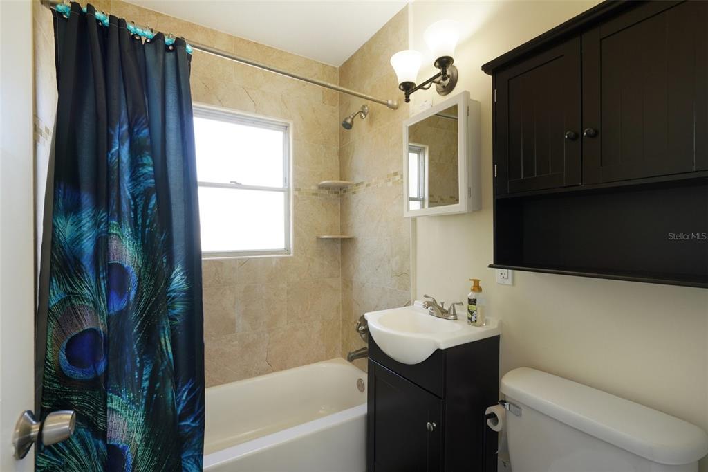 4809 33rd Avenue North St. Petersburg, FL 33713 - Photo 23 of 62 a bathroom with a sink toilet and shower