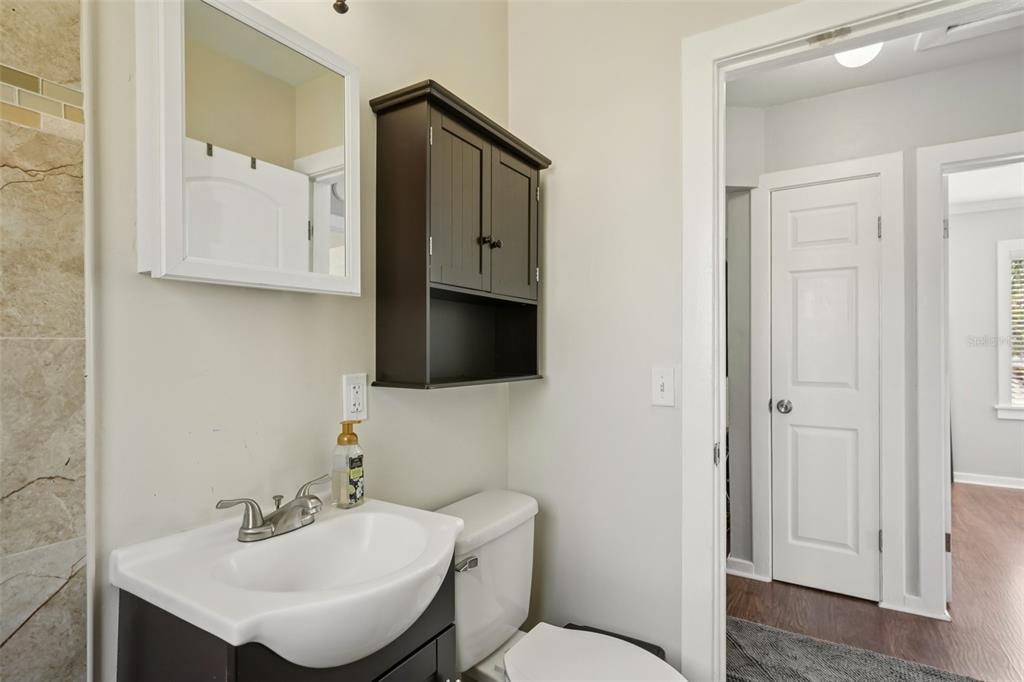 4809 33rd Avenue North St. Petersburg, FL 33713 - Photo 25 of 62 a bathroom with a toilet a sink and mirror