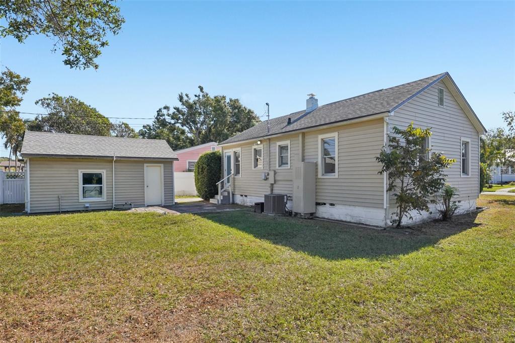 4809 33rd Avenue North St. Petersburg, FL 33713 - Photo 39 of 62 a view of a backyard with plants and a large tree